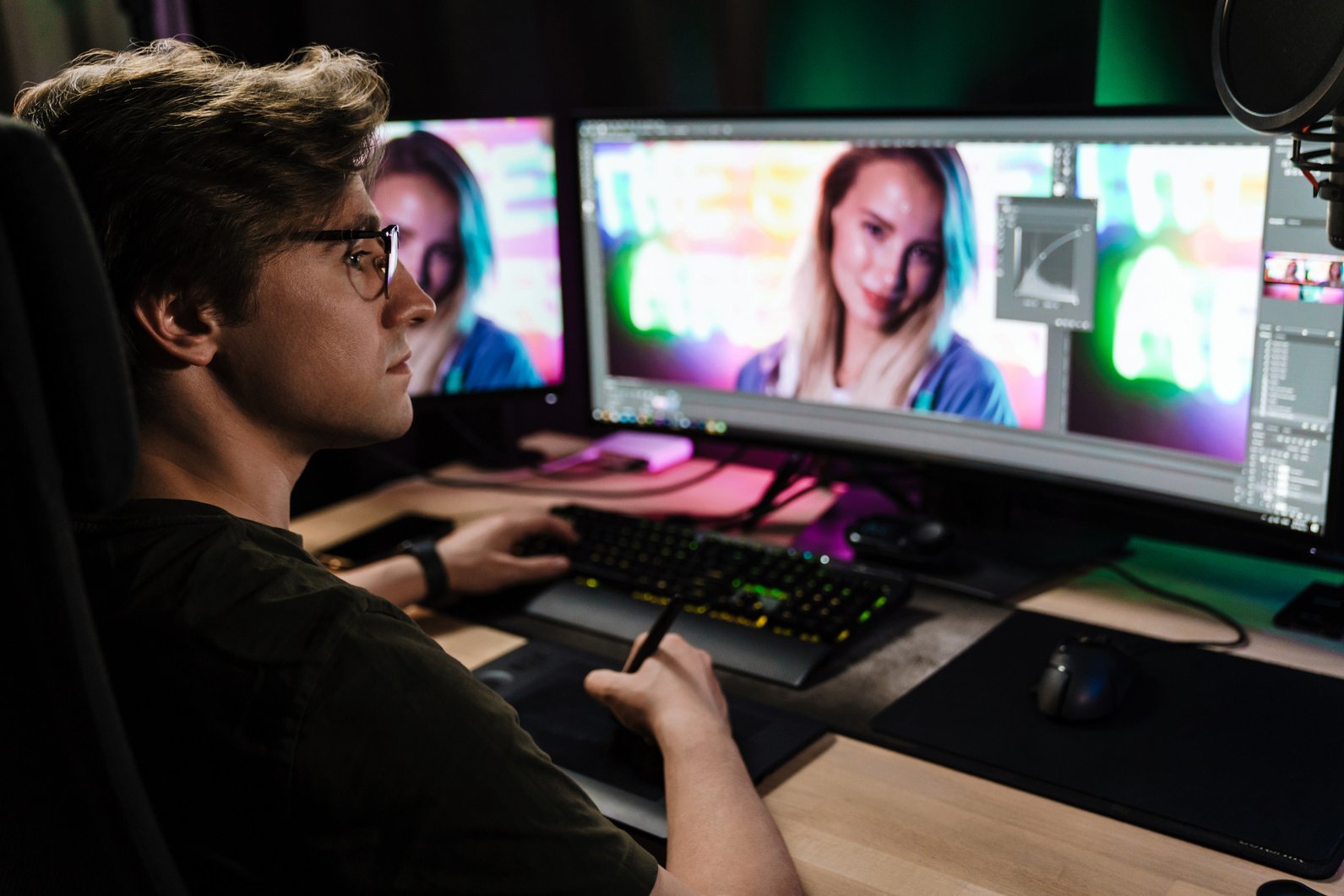 Back View of a Young White Man Video Editor